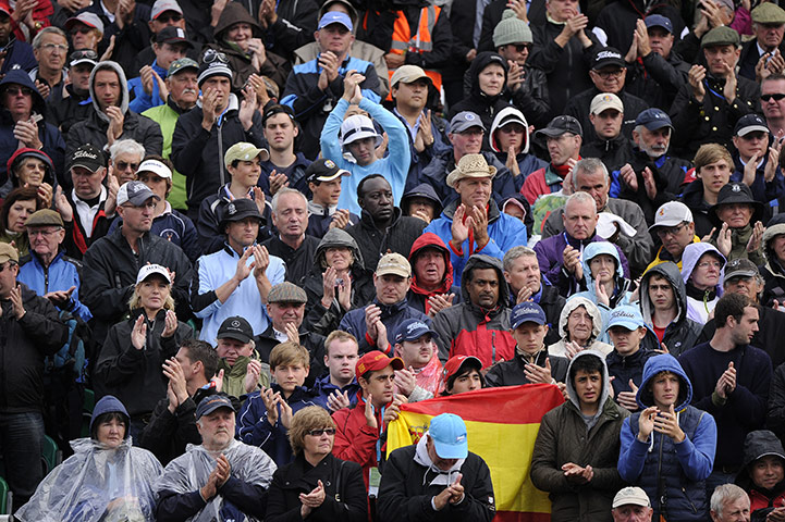 Open day 4: The crowd at the 18th green stand and applaud for Seve Ballesteros