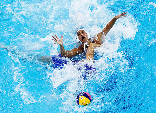 Days Two and Three FINA: Canetti of Brazil fights for the with Belyaeva of Russia during water polo