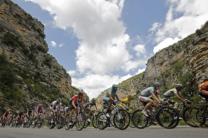Tour de france stage 16: The peloton rides through a canyon near Saint May 