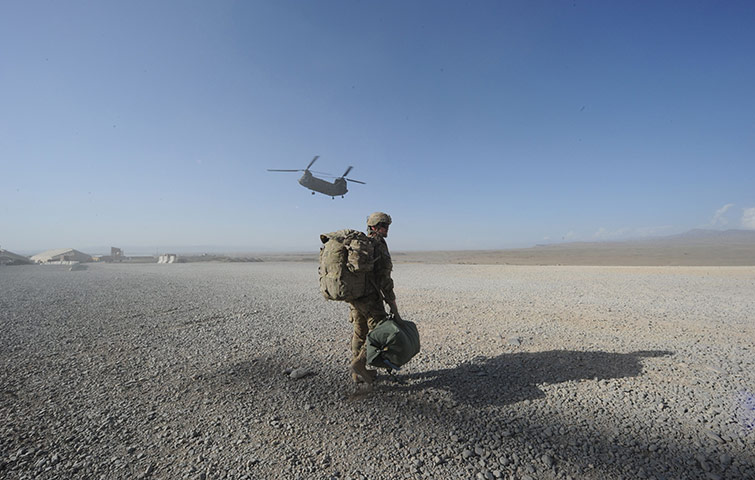 24 Hours: A US soldier walks as a Chinook helicopter prepares to land
