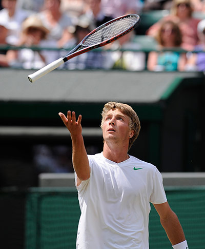 Wimbledon day 12: A frustrated Liam Broady throws his racquet in the air