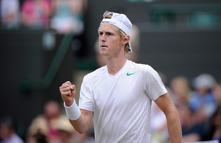 Wimbledon day 12: Luke Saville celebrates winning a point