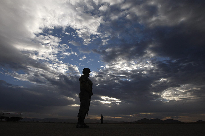 24 hours in pictures: Soldiers stand guard at a military base in the town of Casas Grandes