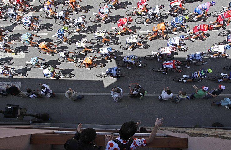 TDF Stage 17: Spectators point at the riders as they climb La Chaussee