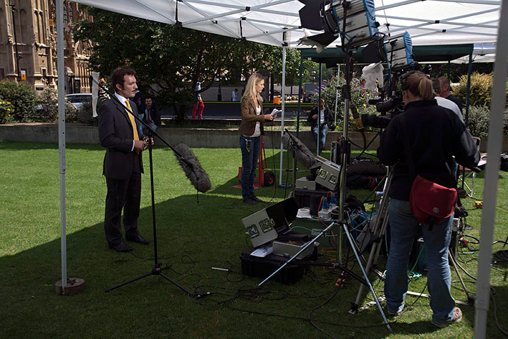 College Green media: Two international tv reporters rehearse their lines 
