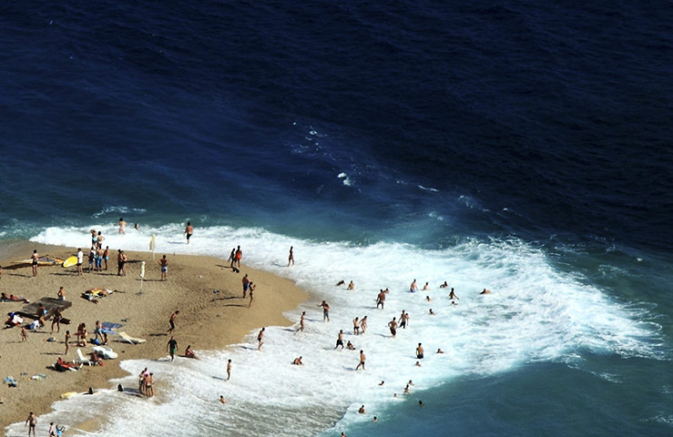 24 hours: Brac, Croatia: Beachgoers on a beach known as the Zlatni rat 