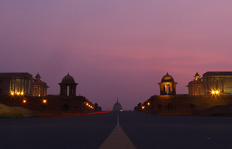 24 hours: New Delhi, India: A late evening monsoon cloud catches the last light