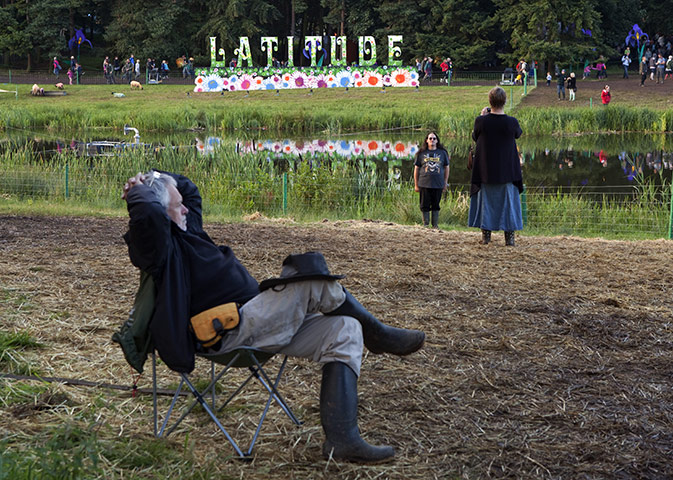 Latitude 2011: A man relaxes by the lake
