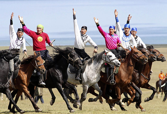 Son-Kul lake festival: Horsemen perform during a festival