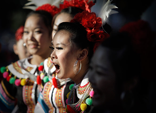 24 hours in pictures: A Chinese performer cheers at International Folk Festival in Sofia