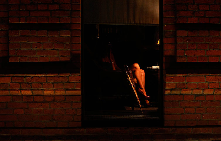 24 hours in pictures: A Russian woman partially seen in nightclub Moscow, Russia