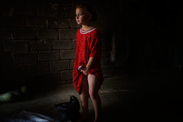 24 hours in pictures: Girl cries after a female circumcision was performed on her, Iraq