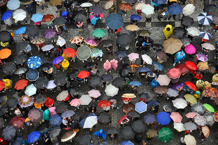 24 hours in pictures: Tourists visiting  the Old Town Square in Prague