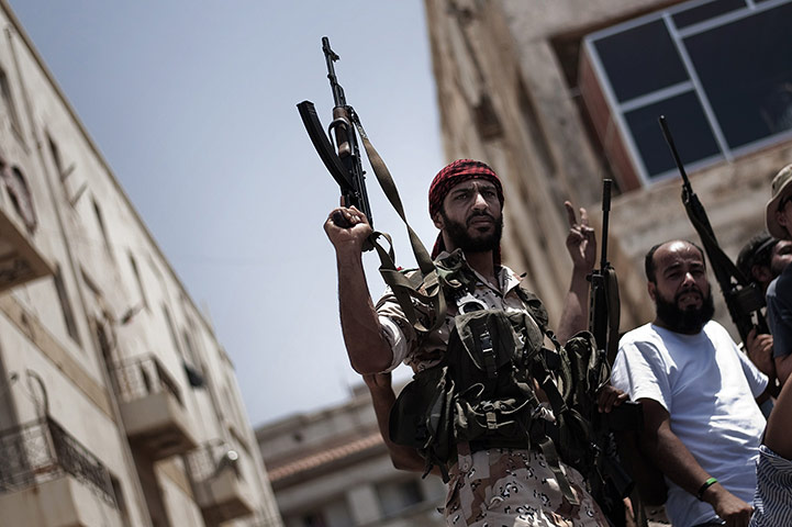24 Hours: Rebel fighters attend the funeral of four comrades killed in Benghazi