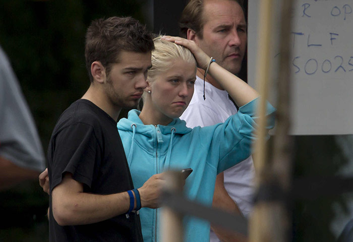 Norway Attack: A survivor from the shooting embraces a man in Sundvolden