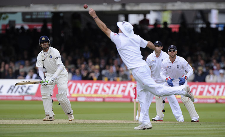 Eng v India Day 2 Test 1: Dravid has a shot saved by a dive from Strauss off the bowling of Swann