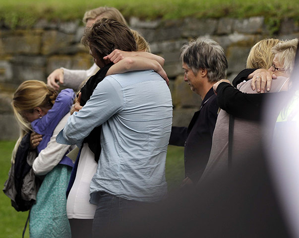 Norway aftermath: People mourn after a memorial service in Norderhov 