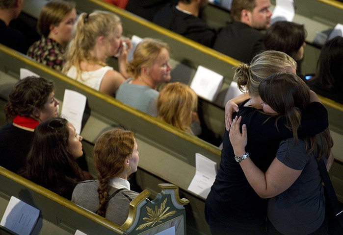 Norway aftermath: People mourn at the Domkirken cathedral in Oslo