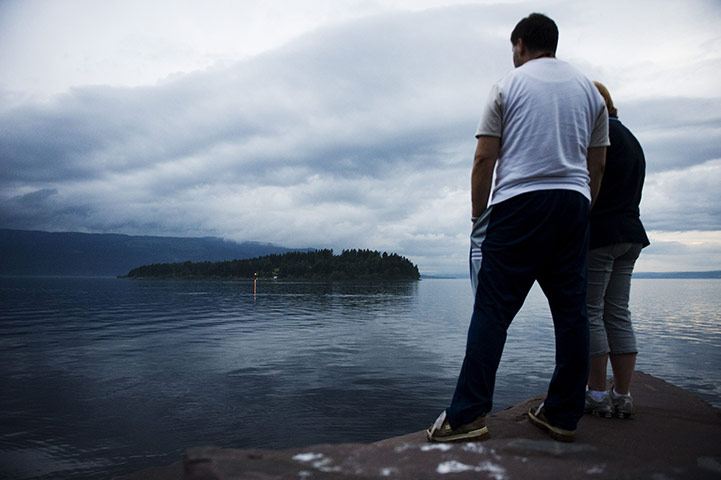 24 hours: Bystanders look at Utøya Island, Norway
