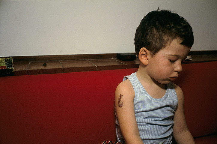 Nan Goldin:  Bruno with a fake tattoo on his arm by Nan Goldin