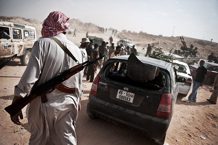 24 hours: Gualish, Libya: Libyan rebel fighters gather at the front line