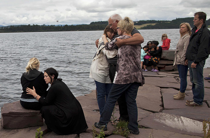 Norway attacks aftermath: Relatives and wellwishers gather to observe a minute's silence