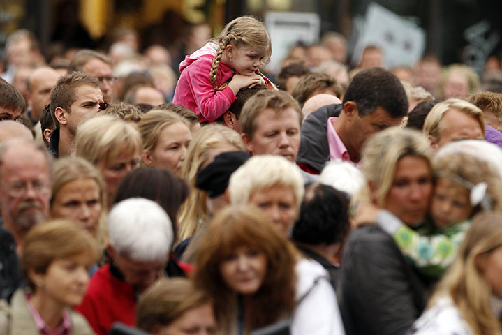 Norway attacks aftermath: People observe the silence outside the Oslo Cathedral