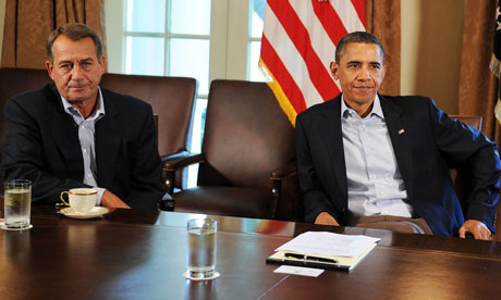 The happy couple: President Obama and Republican Speaker of the House John Boehner could both be out of a job in 2013. Photograph: Jewel Samad/AFP/Getty Images