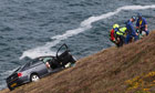 Motorist plunges down cliff