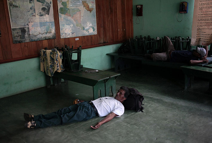 FTA: Jorge Dan Lopez: Men from Honduras rest in a Casa del Migrante (Migrant House)