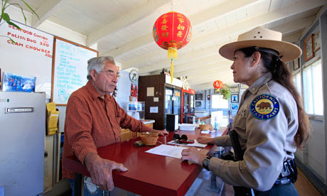 Before 2 August, already short of money: superintendent Danita Rodriguez chats to a store owner at China Camp, a former shrimping village on the north shores of San Francisco Bay, one of 70 California state parks slated for closure next year. Photograph: Eric Risberg/AP