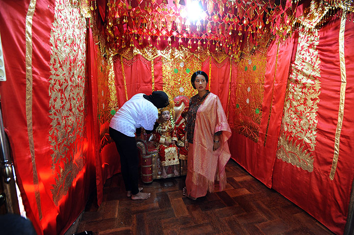Aqikah ceremony, Sumatra: Lianna at her 'Aqika', a traditional Minangkabau ceremony, Sumatra