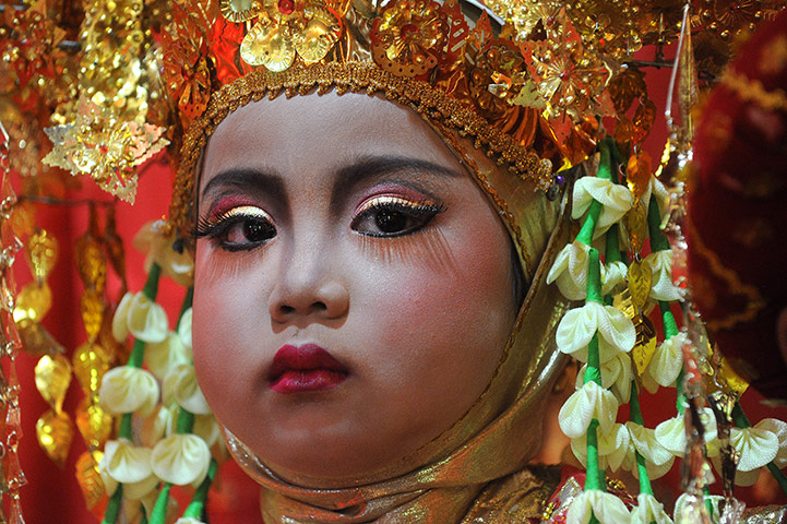 Aqikah ceremony, Sumatra: Lianna at her 'Aqika', a traditional Minangkabau ceremony, Sumatra
