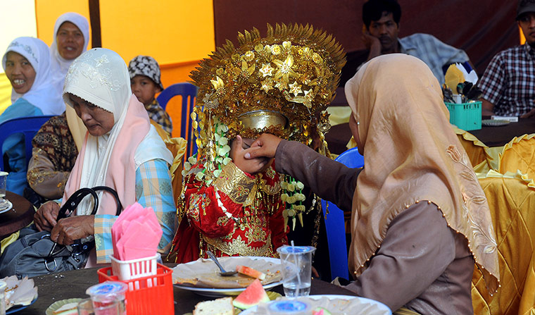 Aqikah ceremony, Sumatra: Lianna at her 'Aqika', a traditional Minangkabau ceremony, Sumatra
