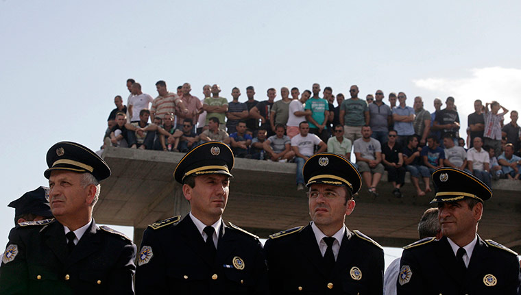 24 hours in pictures: Members of the Kosovo special police unit attend a funeral, Dubovc
