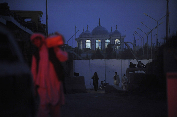 24 hours in pictures: A police checkpoint in front of the Haji Baba Wali shrine in Afghanistan