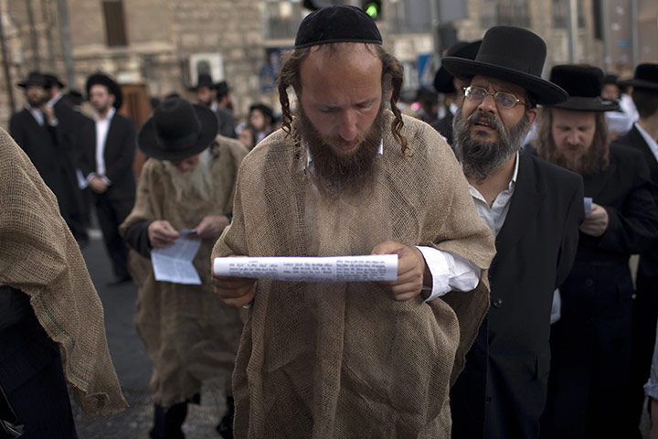 24 hours in pictures: Ultra Orthodox Jews protest against the annual gay pride parade 