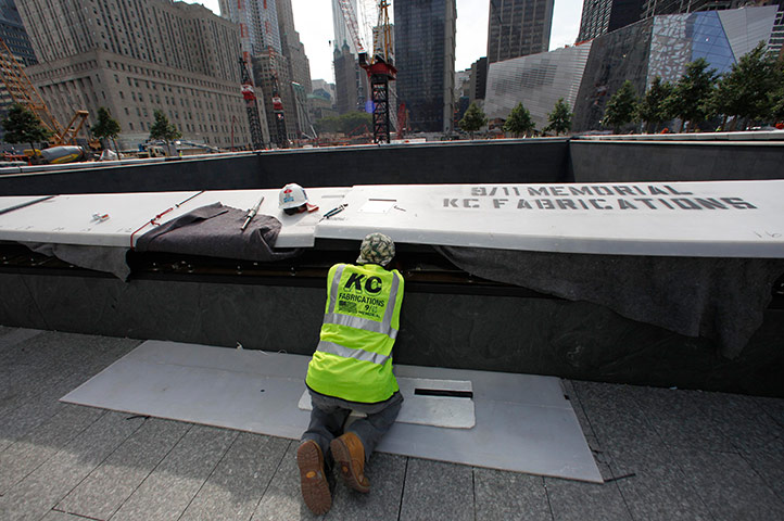 September 11 Memorial: A worker at the North pool waterfall area as work continue