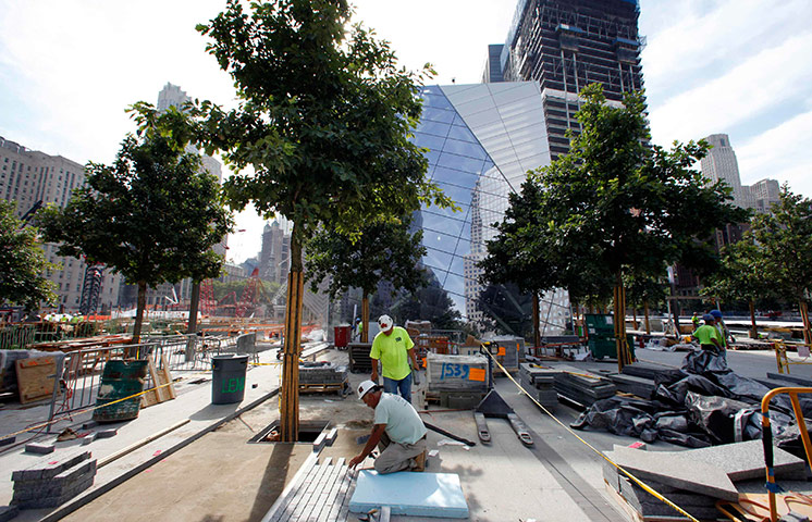 September 11 Memorial: Workers install stone and pavers on the main plaza area 
