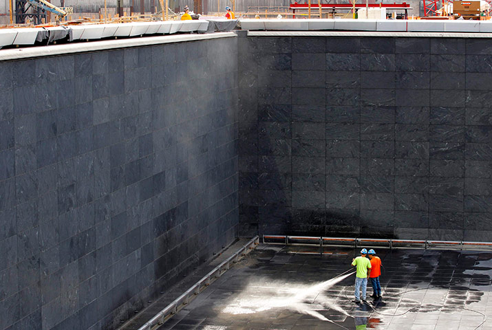 September 11 Memorial: Workers pressure clean inside the North pool waterfall 