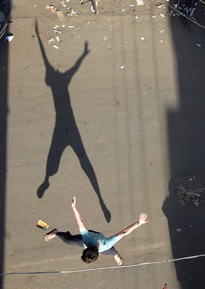 Jump: A shadow of a man jumping by Toby Pear