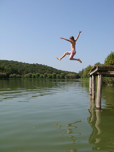 Jump: A bpy jumping into a lake in France by Matthew Chaney