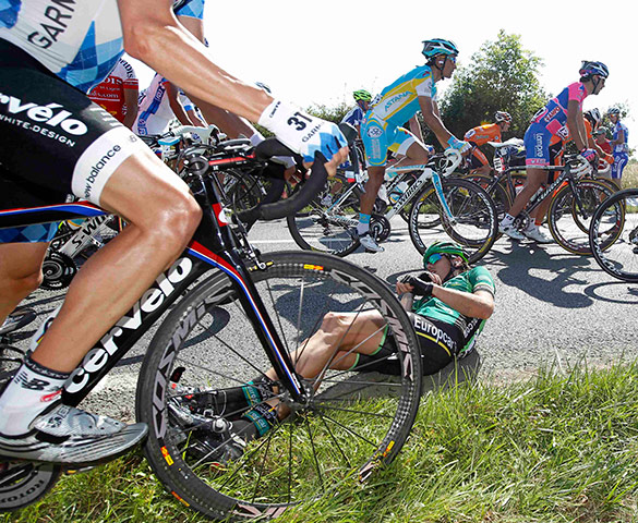 Tour de France stage 1: Europcar rider Vincent Jerome lies down after a crash 