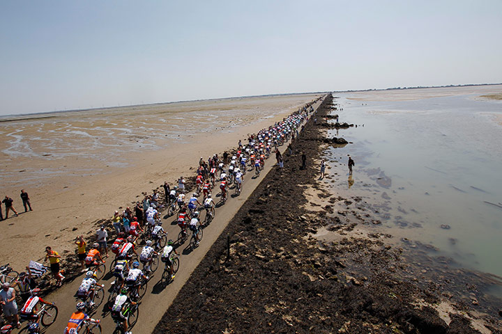 Tour de France stage 1: The peloton passes along the Passage du Gois