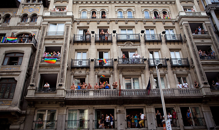 24 hours in pictures: Balconies at Gran Via during the gay and lesbian pride parade, Spain