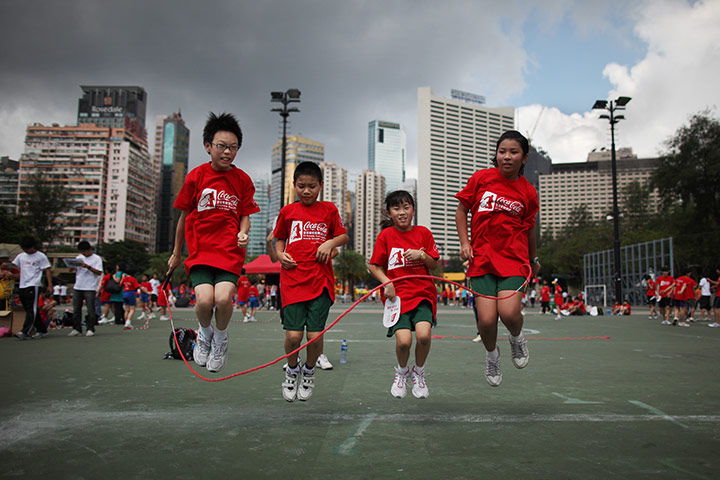 24 hours in pictures: Children skipping during an attempt to set a record, Hong Kong