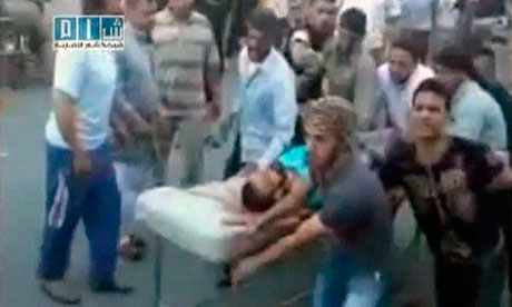 Syria: unverified video still shows a man being rushed to hospital