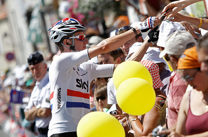 Tour de France Stage 3: Bradley Wiggins of Britain signs autographs at the start of the third stage