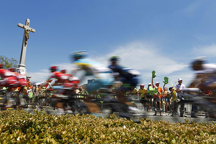 Tour de France Stage 3: The pack rides past a Jesus Christ cross Les Lucs sur Boulogne