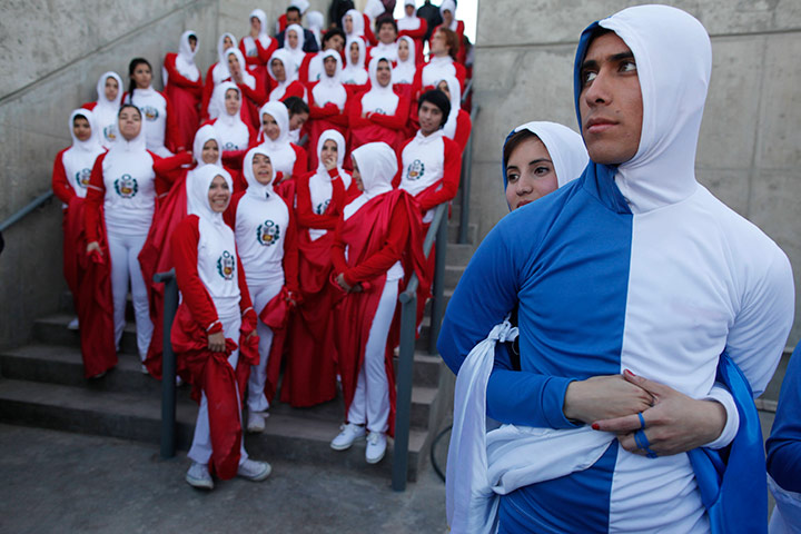 24 hours in pictures: Dancers wearing colours of the Peruvian flag and the Uruguayan flag